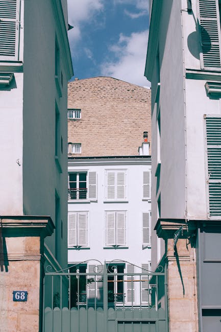Architectural building facade view through alley